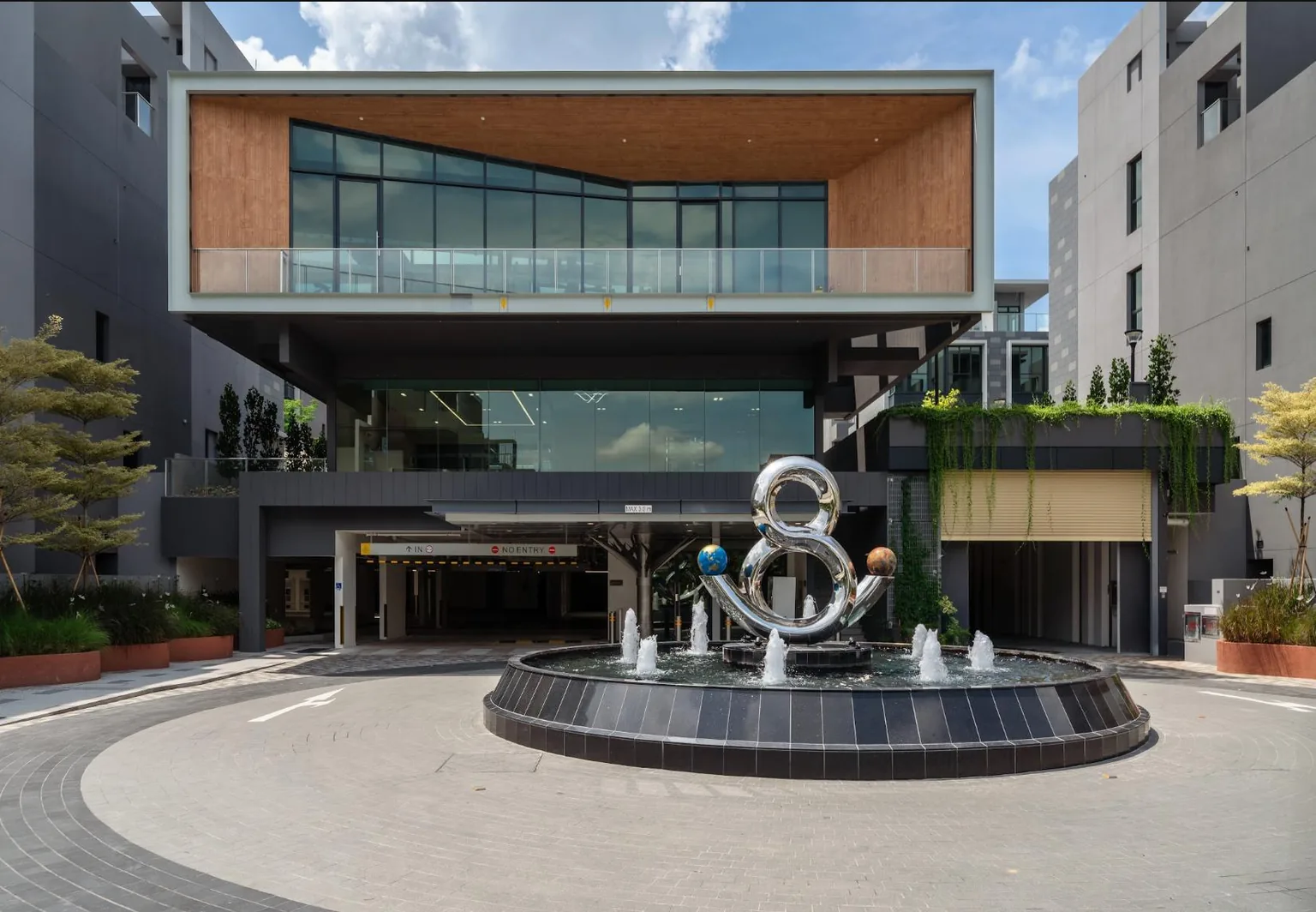 Belgravia Ace clubhouse and roundabout fountain at the estate entrance